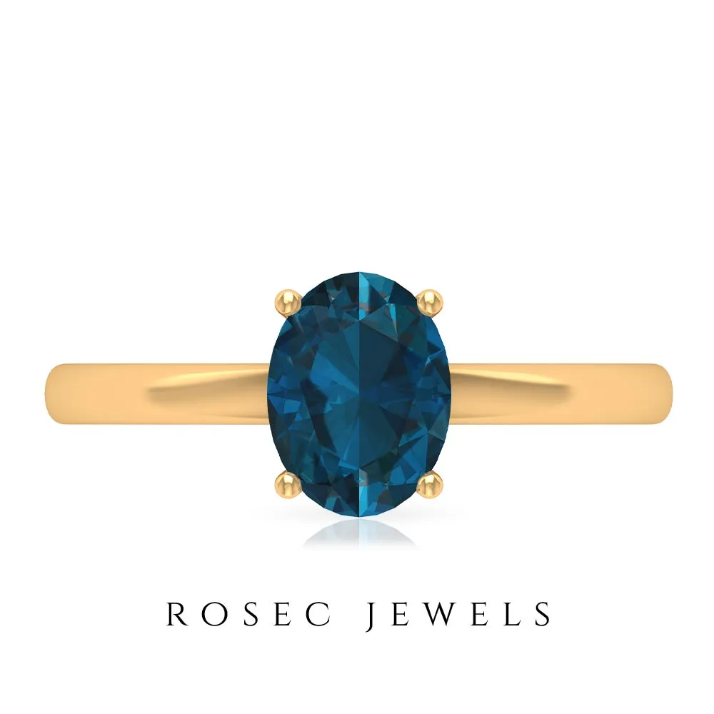 8X6 MM Oval Cut London Blue Topaz Solitaire and Gold Engagement Ring