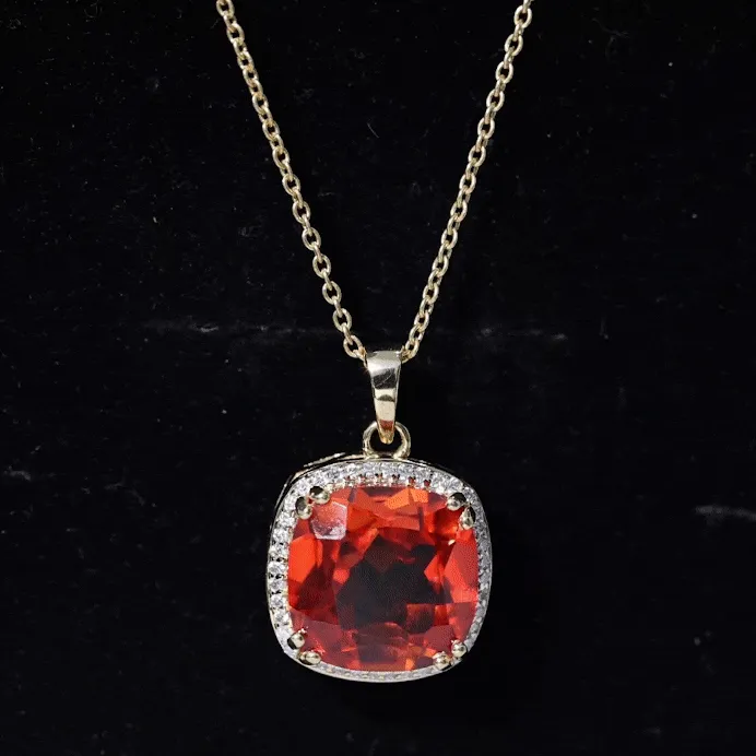 Created Orange Sapphire and Moissanite Halo Pendant Necklace